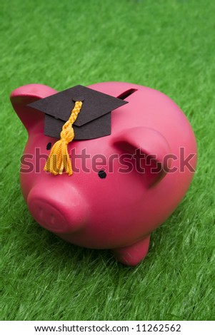Piggy bank with graduation cap – cost of education