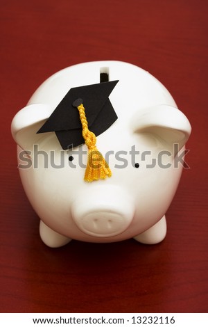 Piggy bank with graduation cap – the cost of education