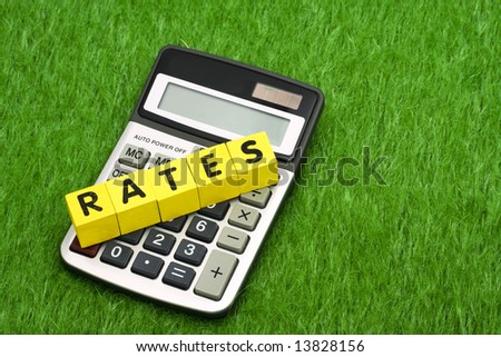 Calculator with alphabet blocks spelling rates - calculating payments