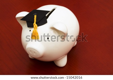 Piggy bank with graduation cap â?? cost of education