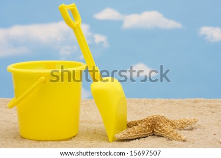 Shovel and bucket in sand -summer time fun