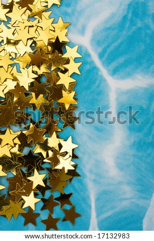 Gold stars making a border on blue background, gold star border