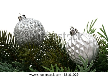 Christmas tree limb with silver glass ball ornaments on white background, Christmas border