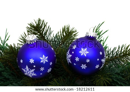 stock photo : Christmas tree limb with blue glass ball ornaments on white 