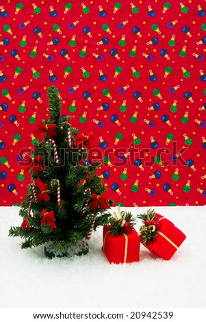 Tree with candy canes and bows on it and presents under it on Christmas background, Christmas tree