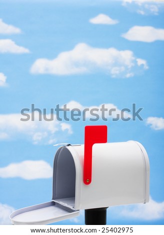 White mailbox with blue sky and cloud background, mailbox