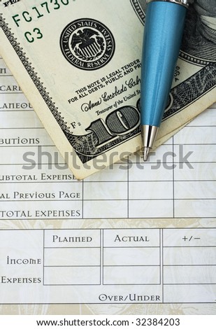 A one hundred dollar bill with pen and budget sheet , budgeting your personal finances