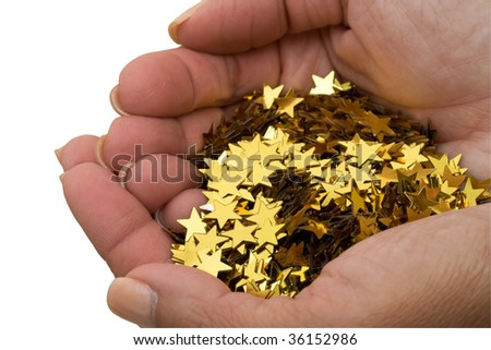 Two hands holding lots of gold stars on a white background, handful of gold stars
