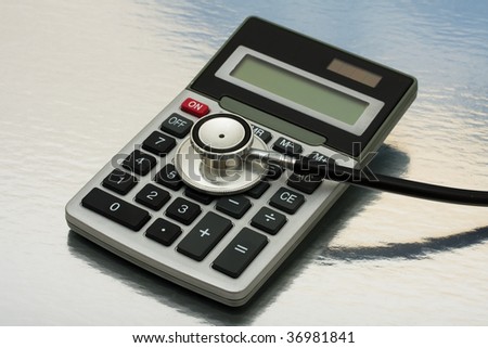 A calculator and stethoscope isolated on a shiny background, calculating healthcare costs