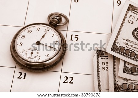 A pocket watch sitting on a calendar background, time management