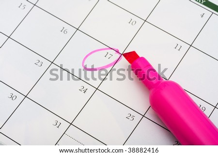 A pink highlighter with a circled day on calendar background, important date