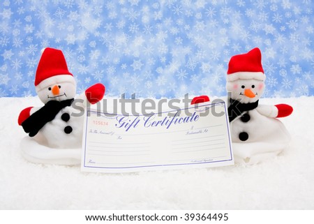 A blank gift certificate with a snowman sitting on snow background, gift certificate
