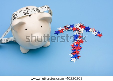 Piggy bank with measuring tape and multi coloured stars making an arrow on blue background, piggy bank,