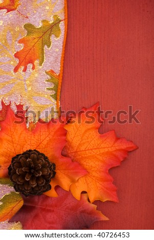 Fall coloured leaves making a border on a wooden background, Fall Leaves