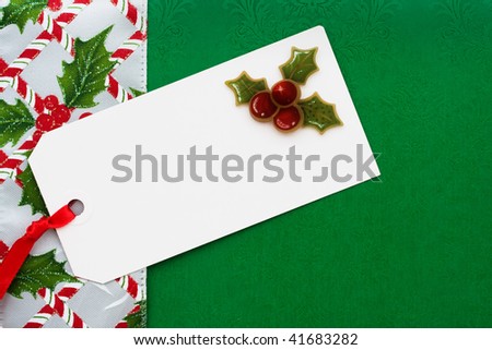 A blank gift tag with ribbon border green background, gift tag