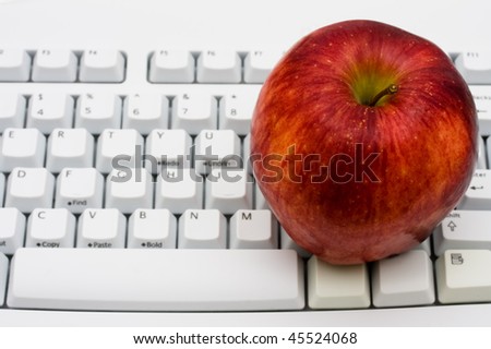 A red apple sitting on top of a computer keyboard, Get advice on healthy lifestyles on line