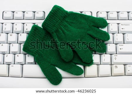 A pair of blue gloves on a computer keyboard, Get your weather reports online