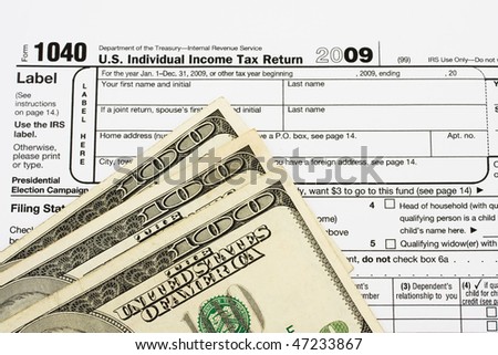 One hundred dollar bills sitting on tax papers, Calculating your tax refund