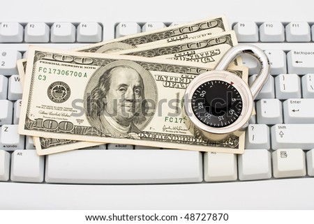 One hundred dollar bills sitting on a computer keyboard, Making Secure Online Purchases