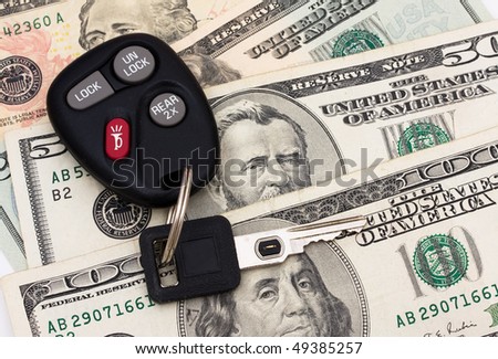 A set of car keys with cash, car payment