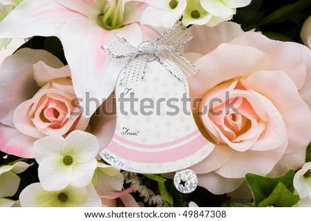 A bouquet of flowers with a bell shaped gift tag, Wedding gift tag