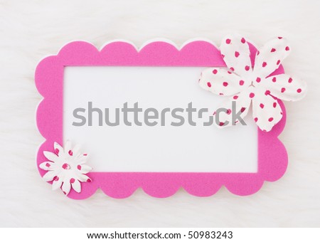 A pink card with flowers on a white background, pink flower card