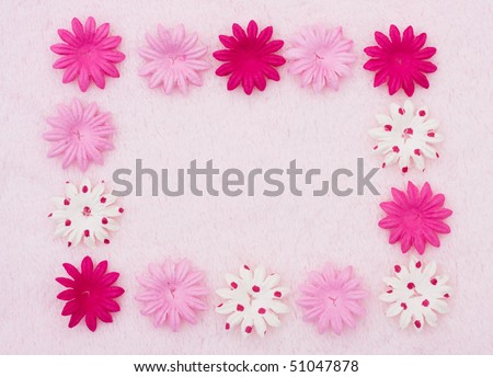 A pink flowers making a border on a pink background, pink flower border