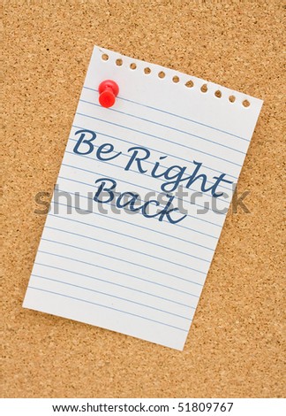 A note on white lined paper tacked to a corkboard, Be right back