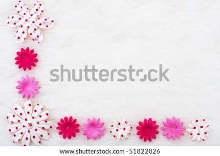 A pink flowers making a border on a white background, pink flower border