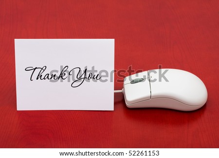 A computer mouse with a thank you card on a red background, Thank You for your online purchase
