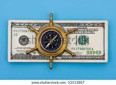 A stack of one hundred dollar bills with a compass on it sitting on a blue background, Exploring your Financial options