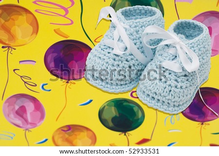 Baby booties on a bright balloon background, Baby Birthday