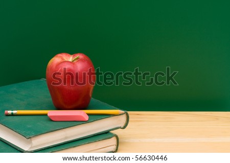 Two old books with an apple in front of the chalkboard, School Days