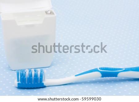 A toothbrush with a box of dental floss, Healthy Dental Hygiene