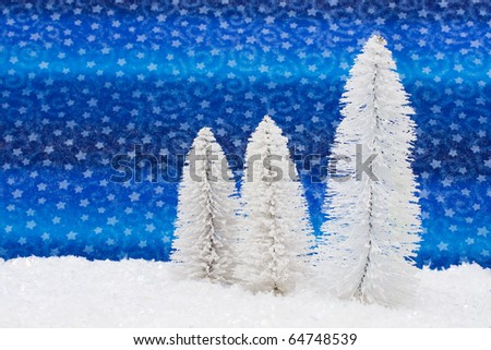 Three white trees on snow with star background, white trees