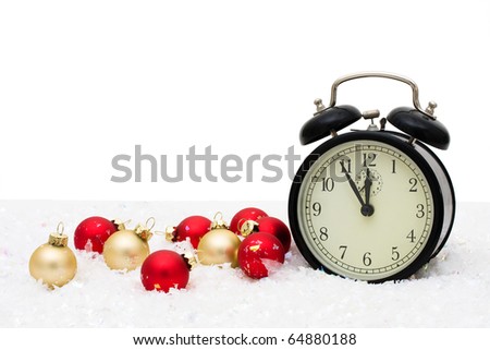 Red and gold glass Christmas balls with an alarm clock on a white background, Christmas Time