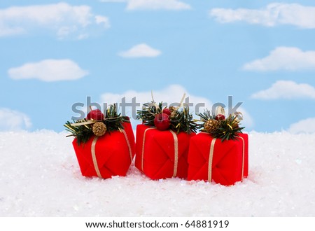 Three red presents on a sky background, Christmas presents