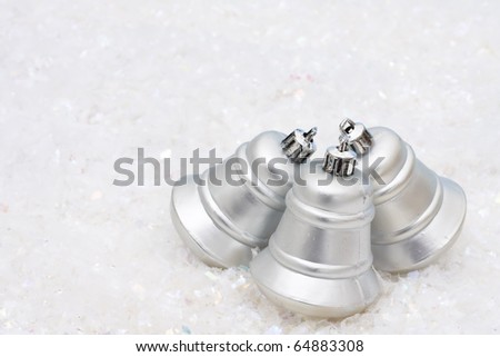 Three silver bells on a white textured background, Christmas Time