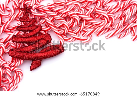 Mini candy canes making a border on a white background, Candy cane border
