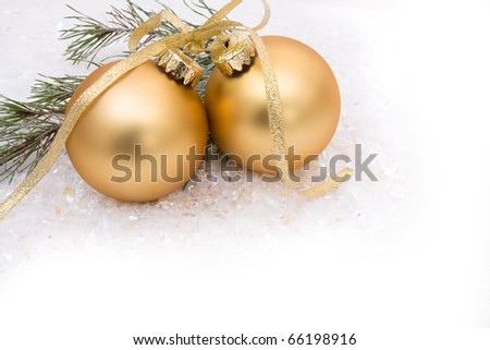 Gold christmas balls on a snow background, christmas time