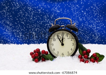 A black vintage face clock sitting on snow background, winter time