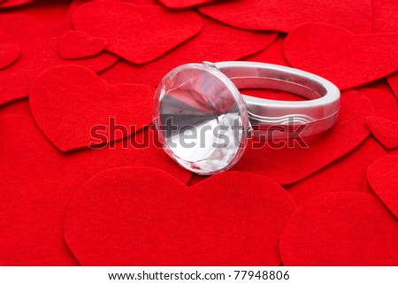 Diamond ring on a red shaped heart background, diamond ring