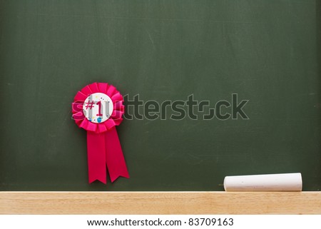 Award and chalk on a chalkboard with lots of copy space, Award winning education