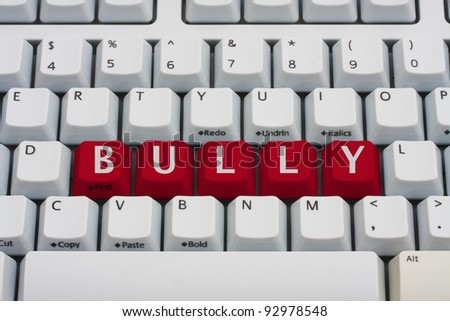 Computer keyboard key displaying word bully, Bullying on the Internet