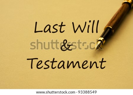 A fountain pen with yellow paper and words last will and testament