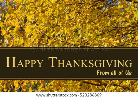 Happy Thanksgiving Greeting, Some fall leaves with text Happy Thanksgiving from all of us