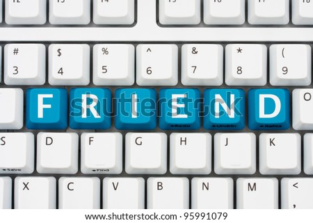 A computer keyboard with blue keys spelling friend, Communicating with friends on the internet