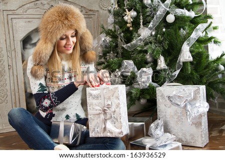 Christmas, x-mas, winter, happiness concept - smiling woman in santa