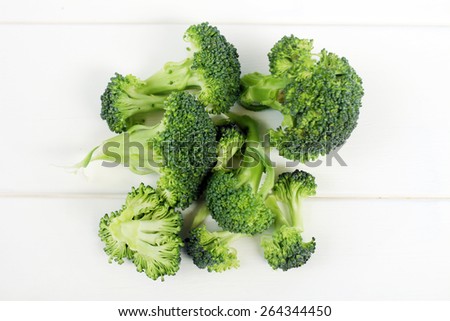 Broccoli isolated on a white wooden background, close up