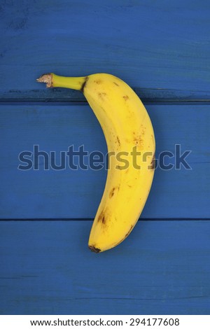 Banana on a background of the old wooden planks painted.